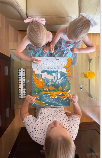 Detail shot of painting inside the lines on a numbered canvas